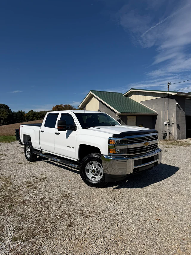 White Chevrolet HD pickup with a clean protected finish