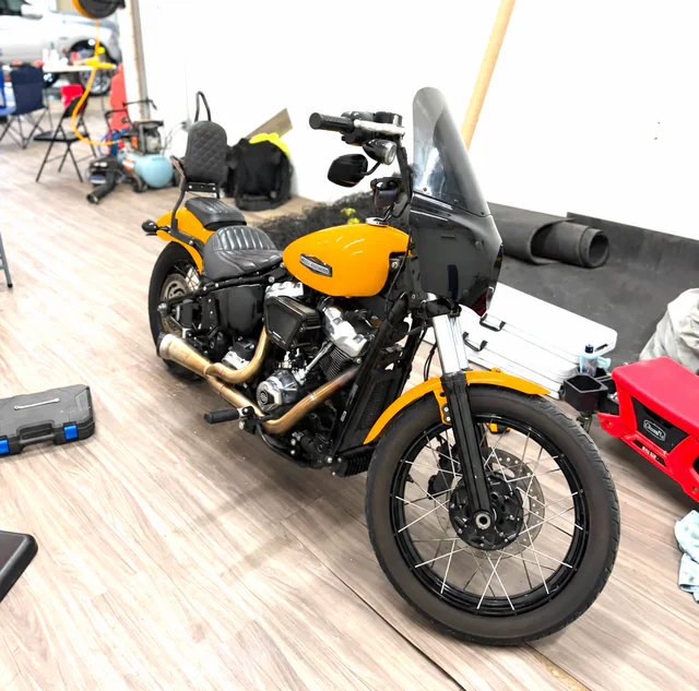 Yellow custom motorcycle detailed to a glossy finish