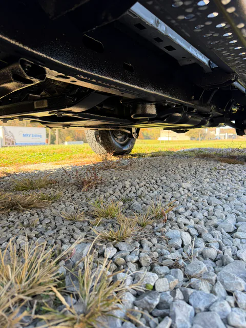 Fresh undercoating across a truck underbody