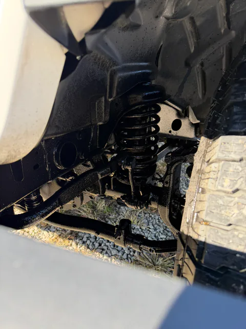 Freshly coated truck wheel well and suspension components